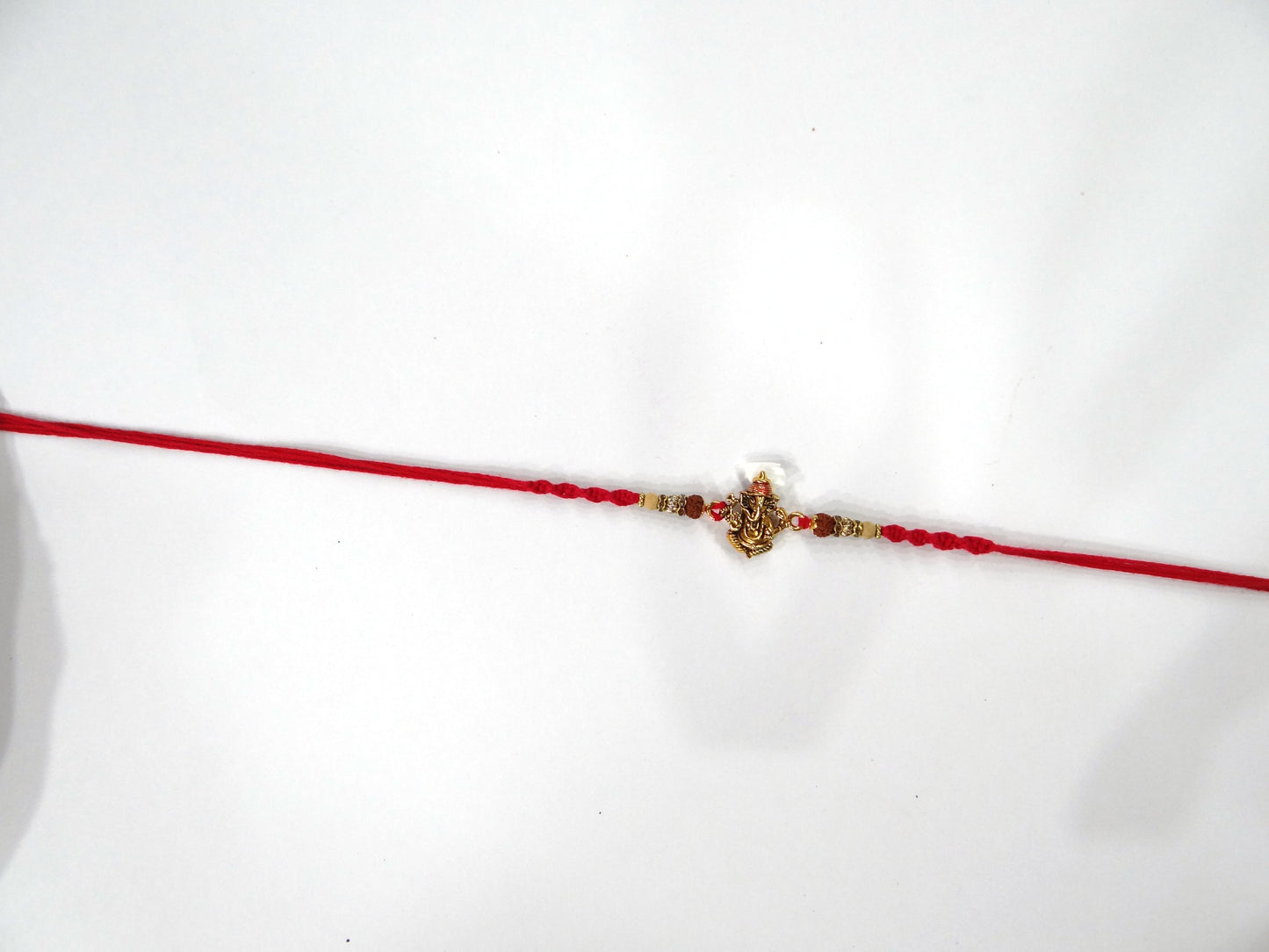 "Ganesh ji with Rudraksha Dora Rakhi By Upharkaro"