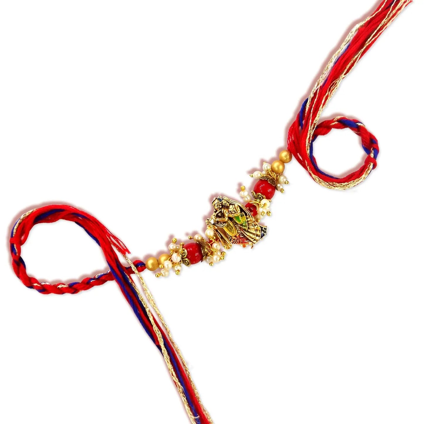 Decorative keychain with red and blue ribbons on a white background