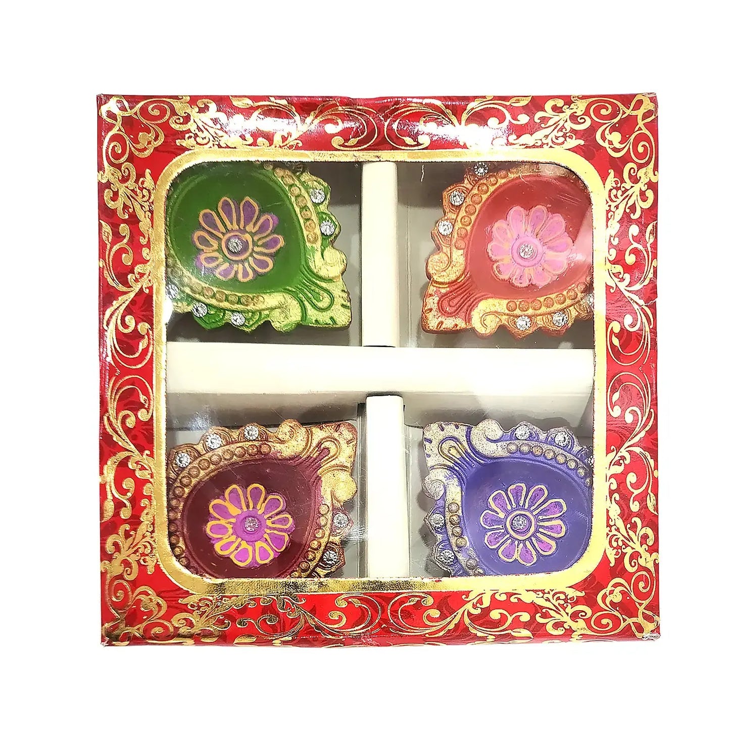 Decorative diwali oil lamps in a red and gold box with floral designs.