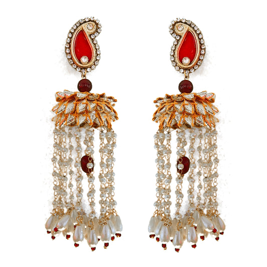 Ornate earrings with red and gold accents on a white background