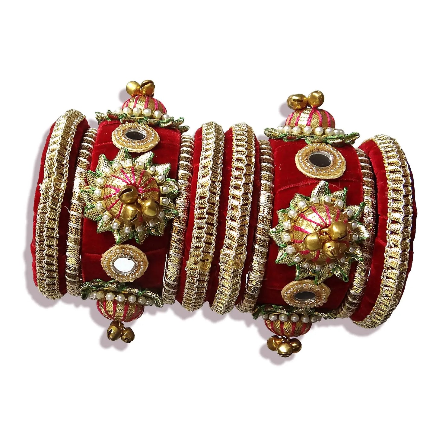 Decorative red and gold bangles on a white background