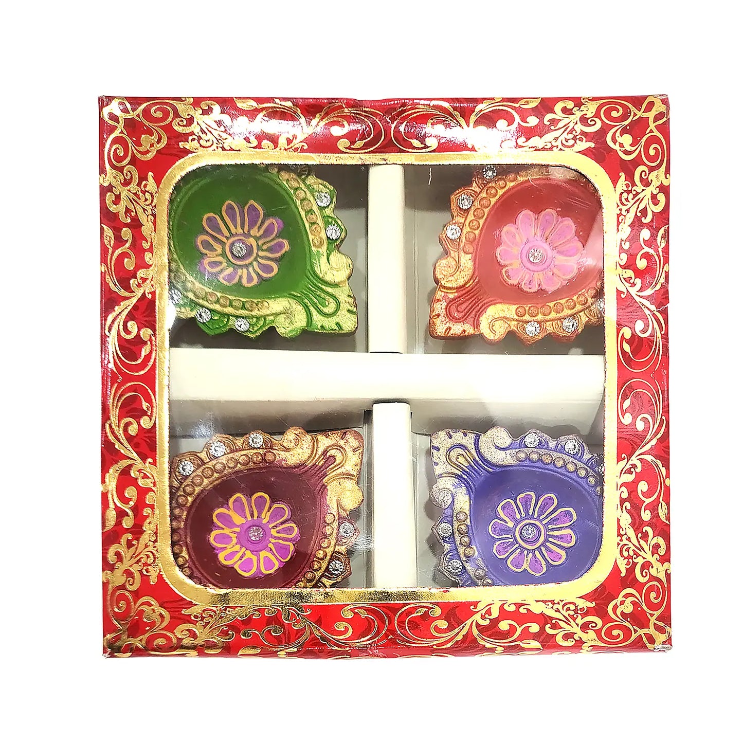 Decorative diwali oil lamps in a red and gold box with floral designs.