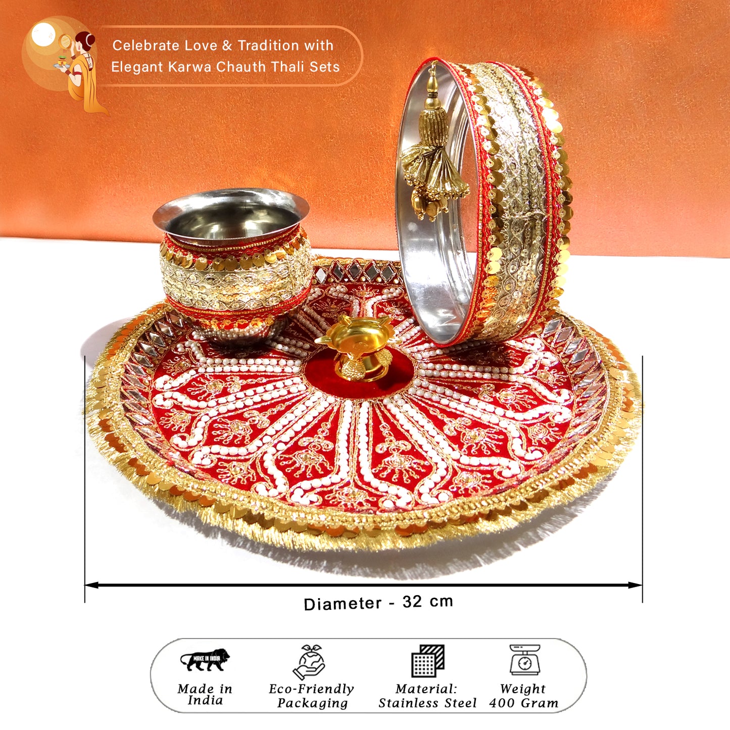 Decorative thali set with gold and red design on a white background