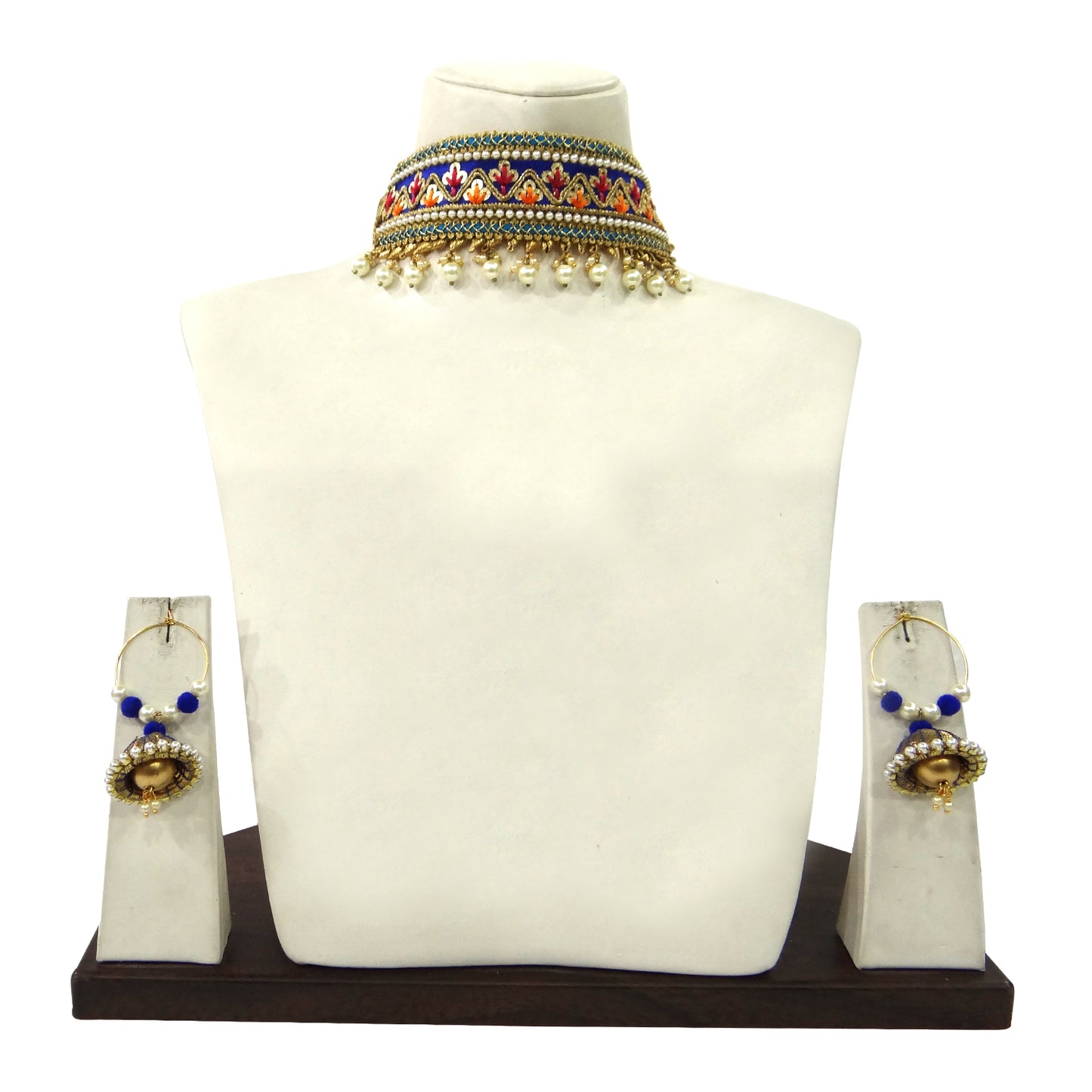 Jewelry set with necklace and earrings on a mannequin bust against a white background