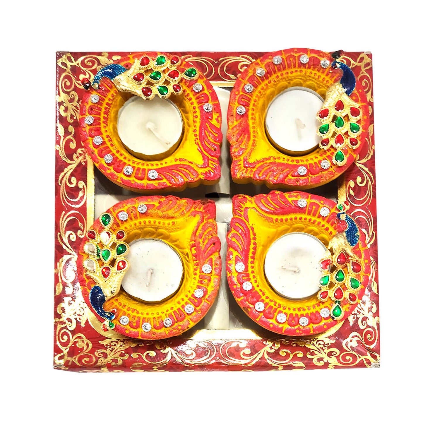 Decorative candles in a box with colorful designs and gemstones.