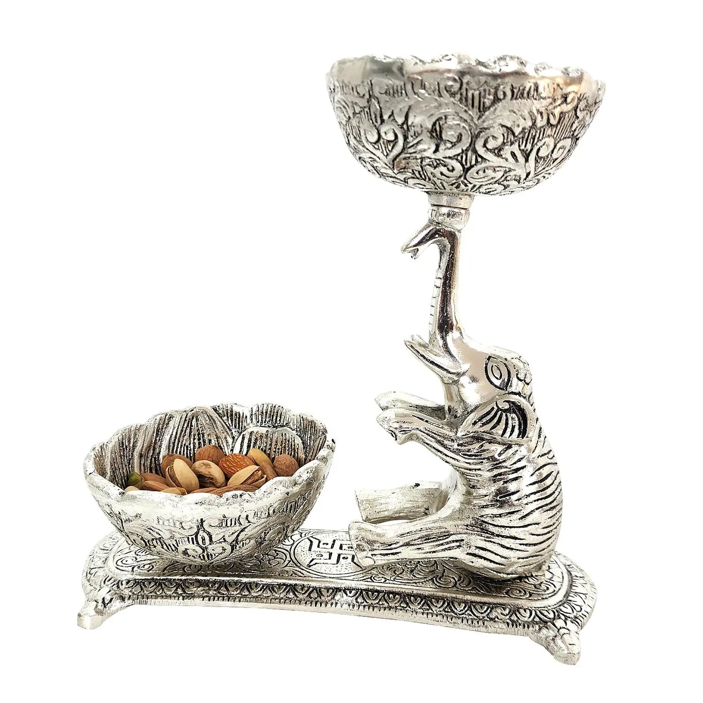 Decorative silver bowl with a dolphin design on a white background