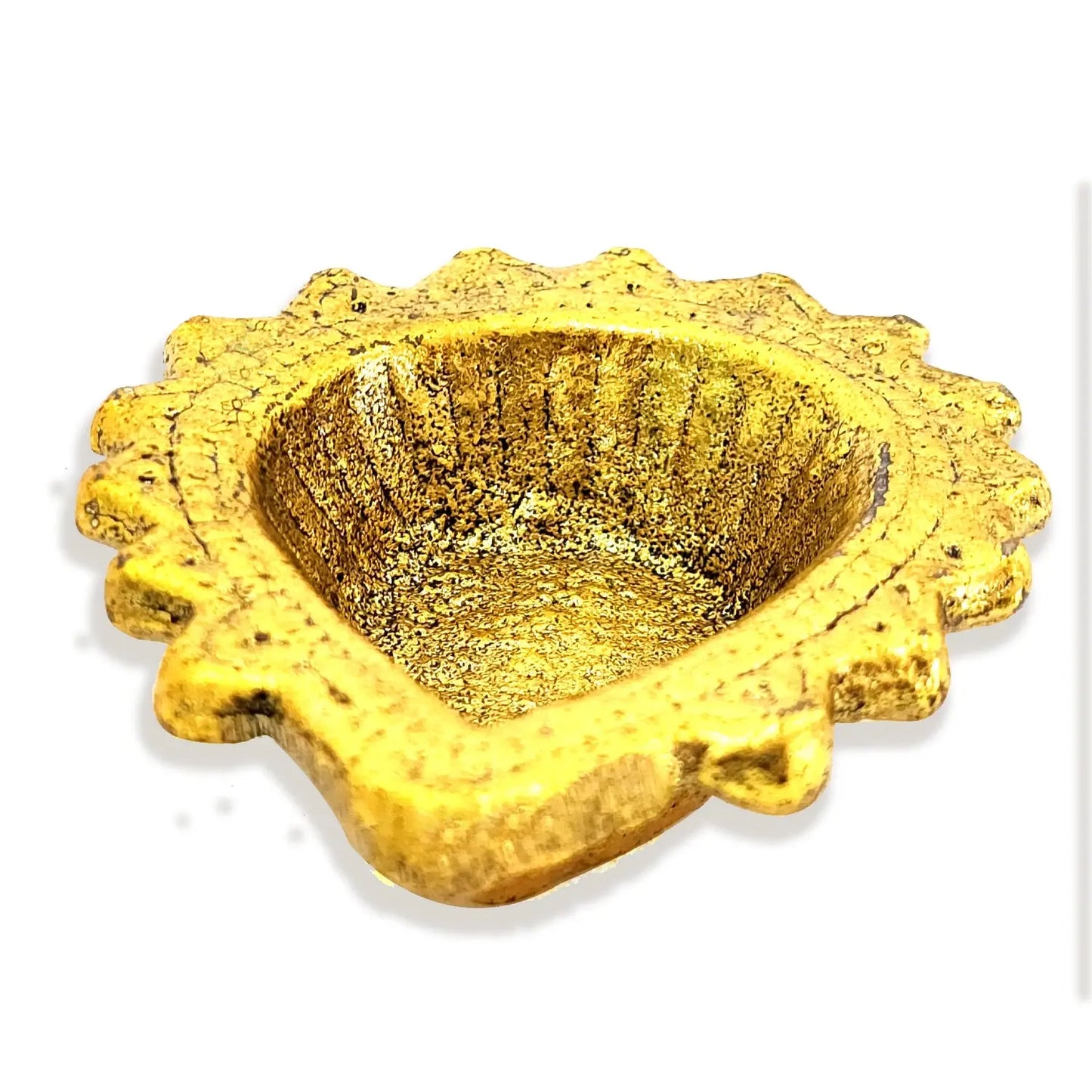 Gold-colored decorative bowl with textured surface on a white background