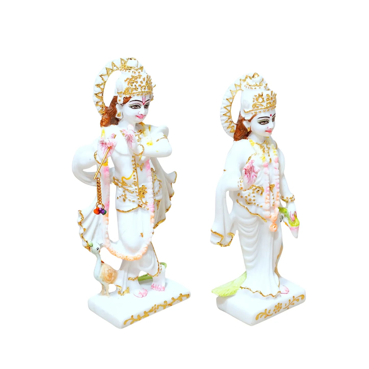 Two statues of a deity with white and gold attire on a white background