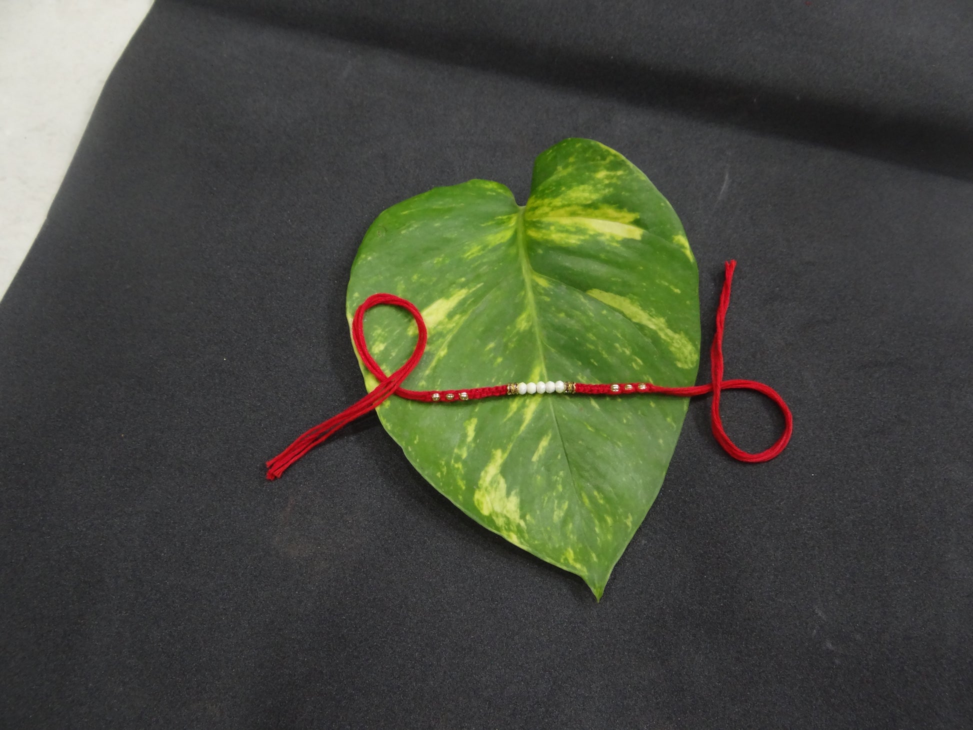 White Pearl Red Dora Rakhi for Brother – Pure & Elegant | Upharkaro-Upharkaro