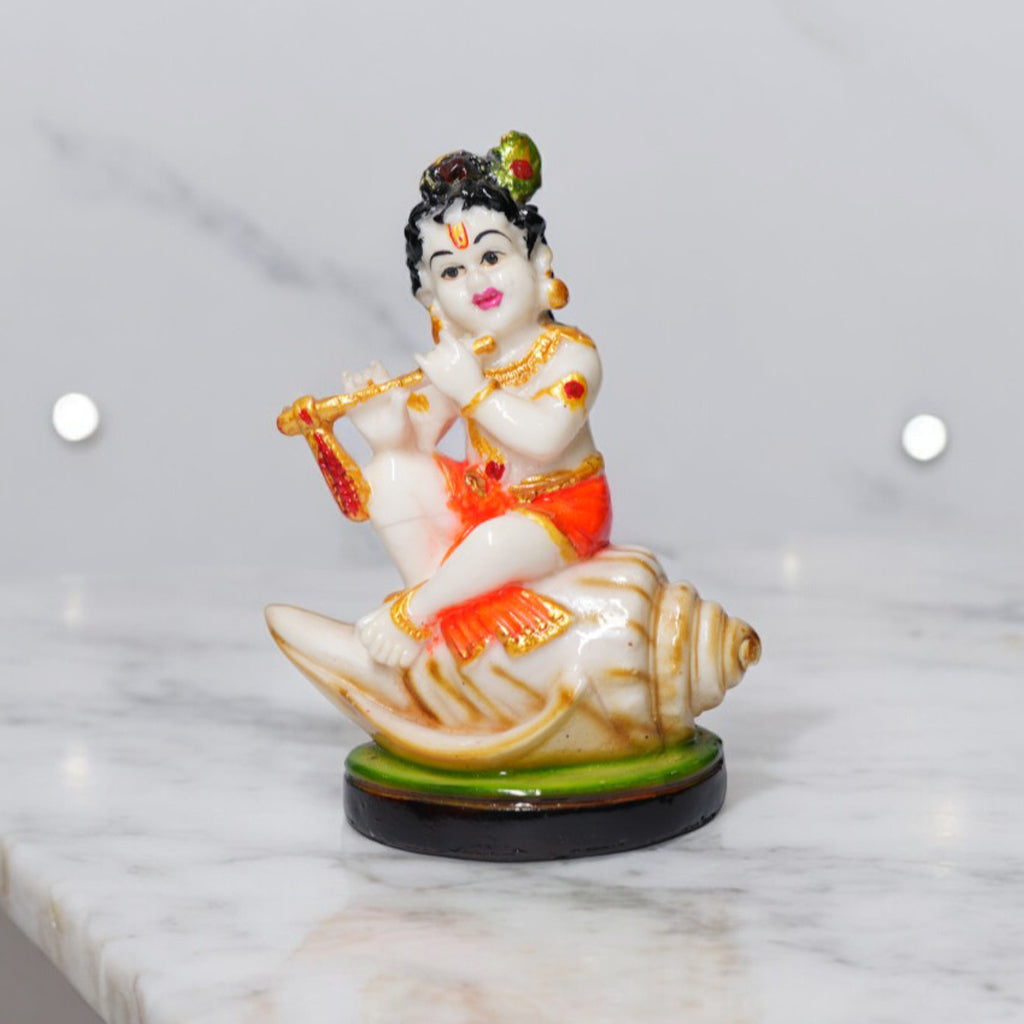 Bal Krishna Playing Bansuri and Sitting on Shankh Sculpture