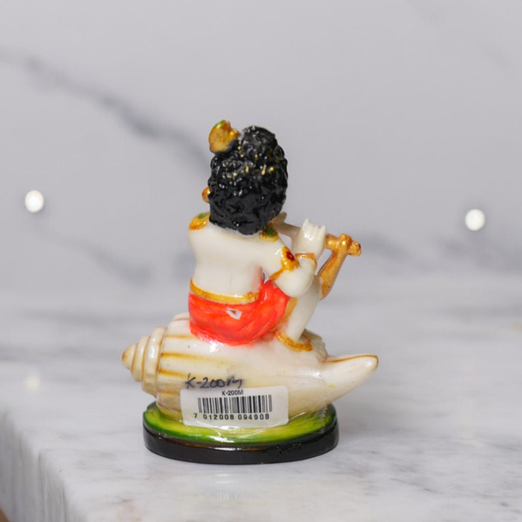 Bal Krishna Playing Bansuri and Sitting on Shankh Sculpture