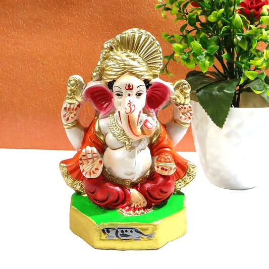  Front view of 6 inch clay Ganesh idol featuring colorful pagri and natural design