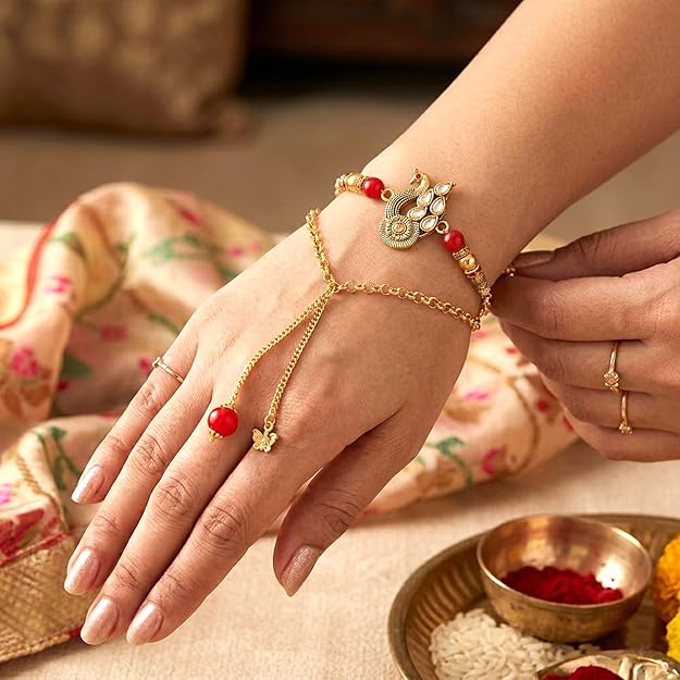 Peacock Charm Bracelet Style Lumba Rakhi with Red Beads for Bhabhi