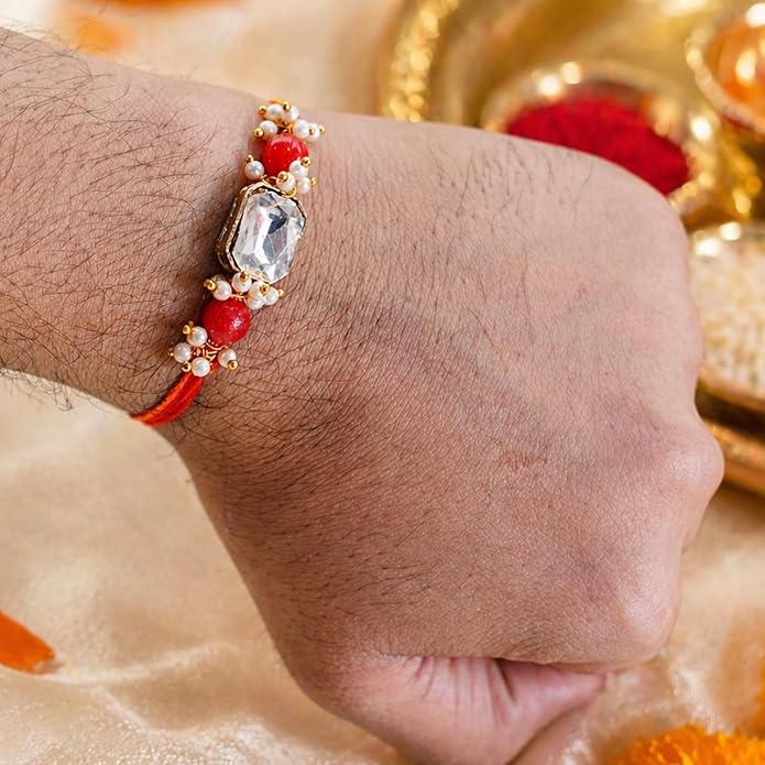 Elegant Handcrafted Stone Rakhi with Vibrant Red Beads and Golden Charms By Upharkaro