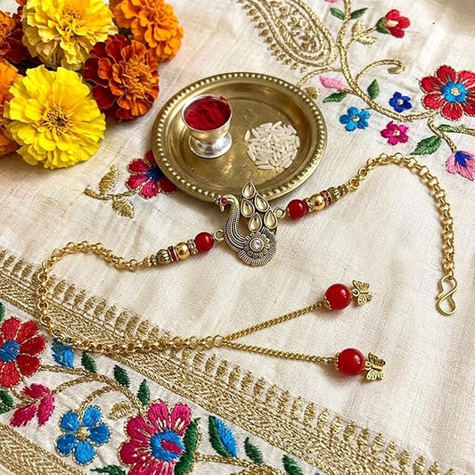 Peacock Charm Bracelet Style Lumba Rakhi with Red Beads for Bhabhi