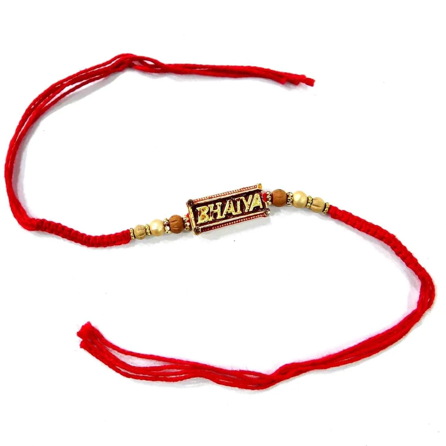 Red string bracelet with a decorative clasp on a white background