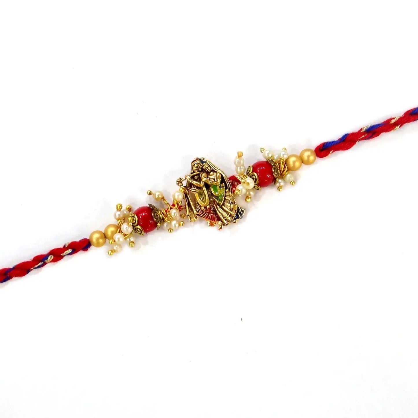 Decorative bracelet with red and gold elements on a white background