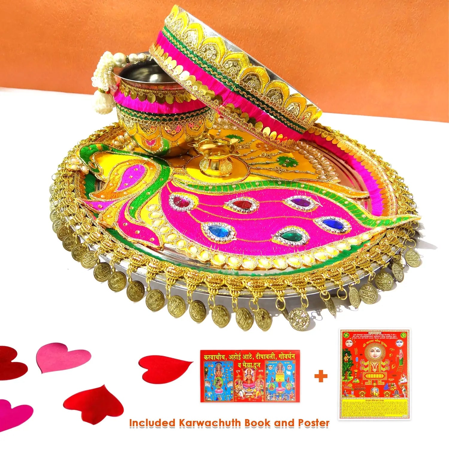 Decorative thali set with colorful tray, candle, and bangles on a white background.