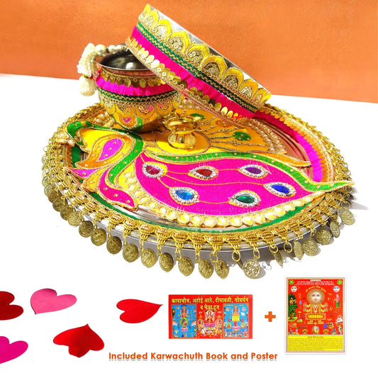 Decorative thali set with colorful tray, candle, and bangles on a white background.