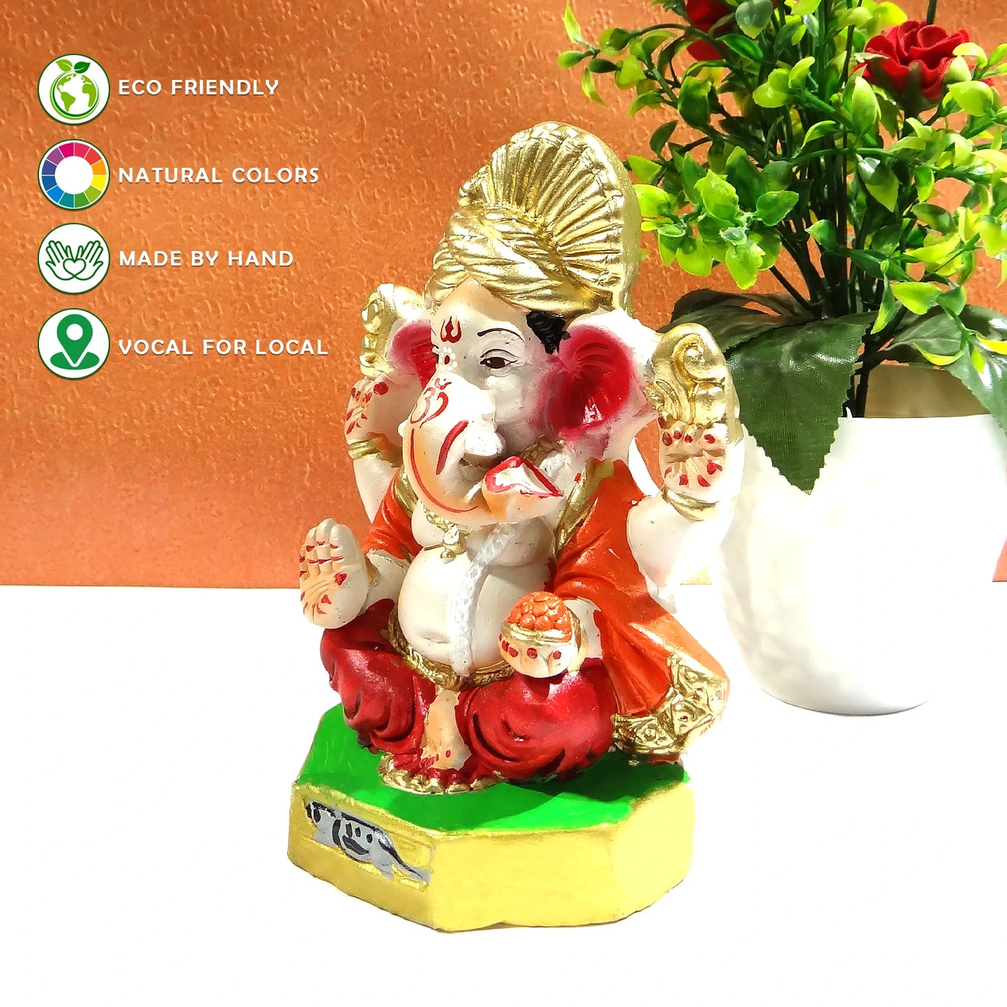 Decorative statue of a神灵 with eco-friendly and handcrafted attributes on a white surface.