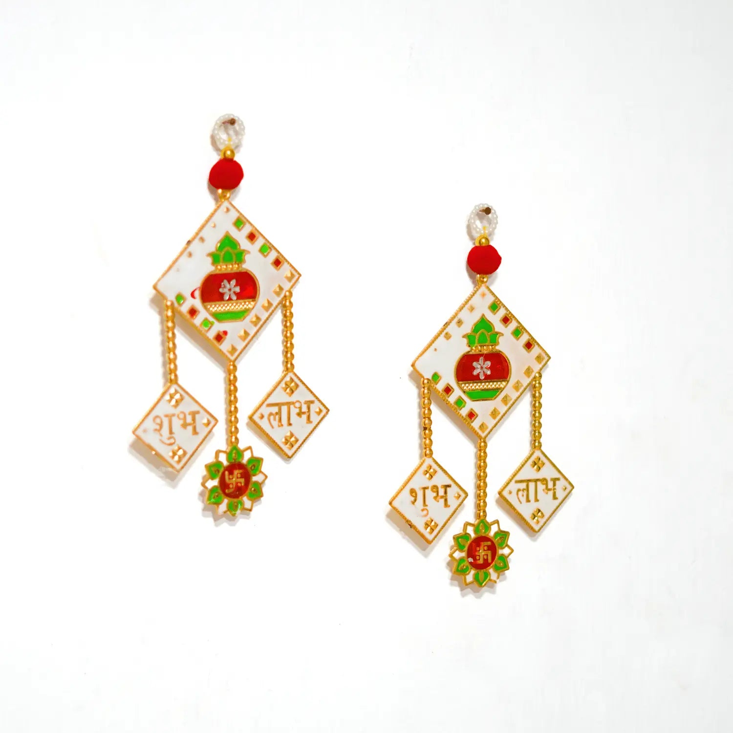 Decorative earrings with intricate designs on a white background