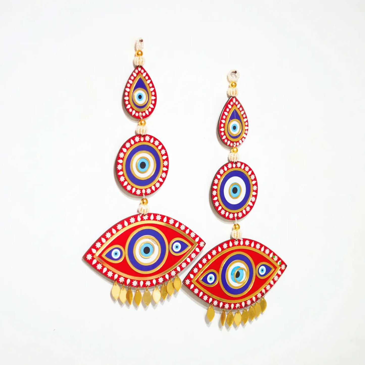 Colorful eye-shaped earrings on a white background