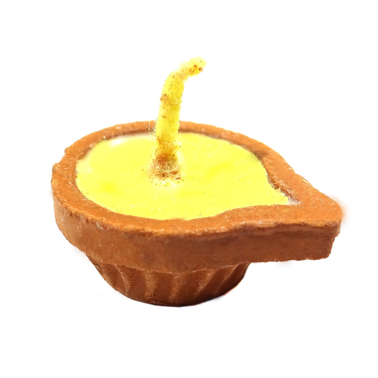 Small candle in the shape of a Diwali oil lamp on a white background