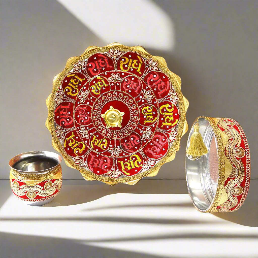 Decorative items including a red and gold plate, cup, and bangles on an orange background.