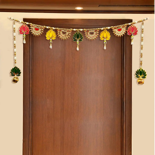 Decorative garland with colorful elements hanging above a wooden door.