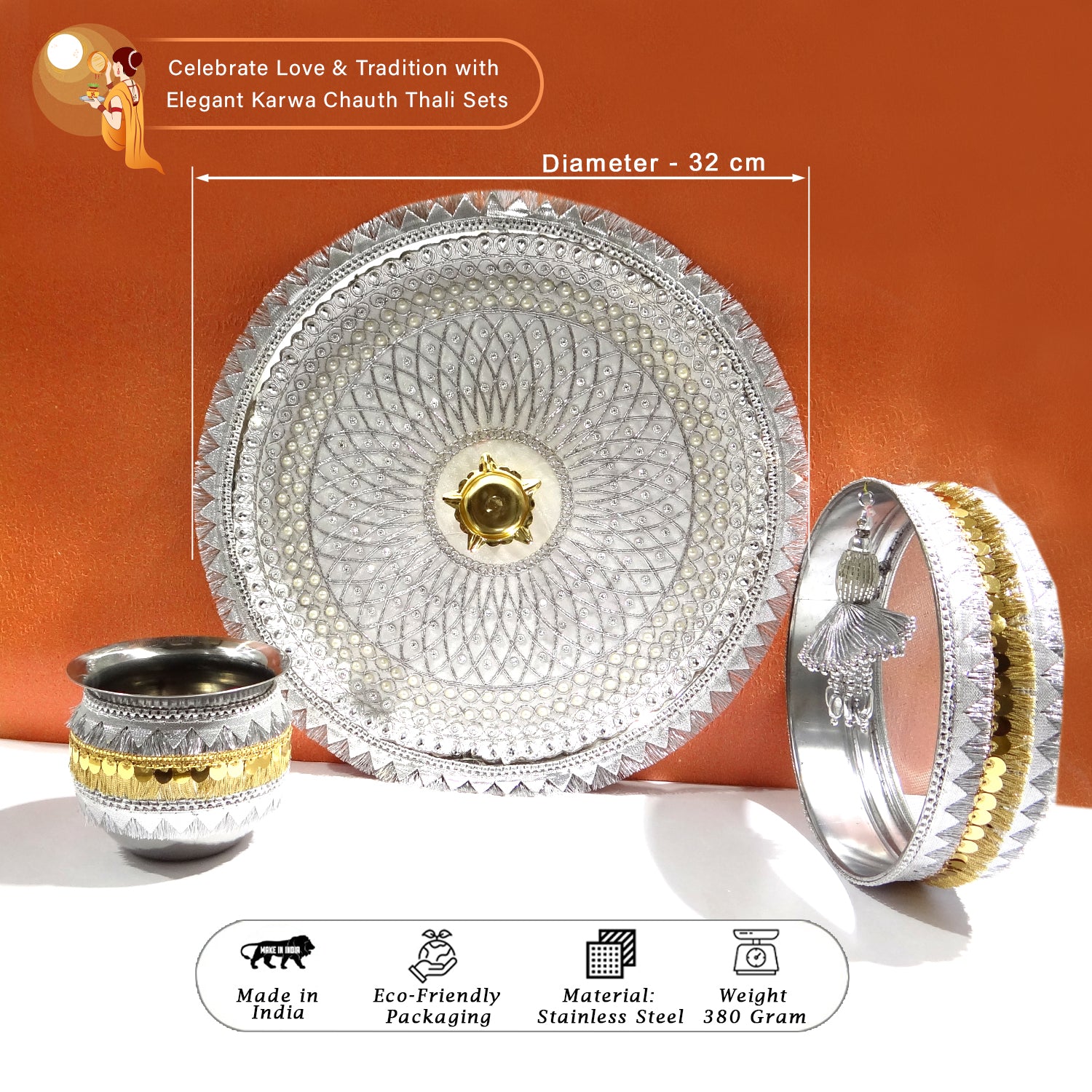 Decorative thali set with bowl, plate, and bangles on an orange background