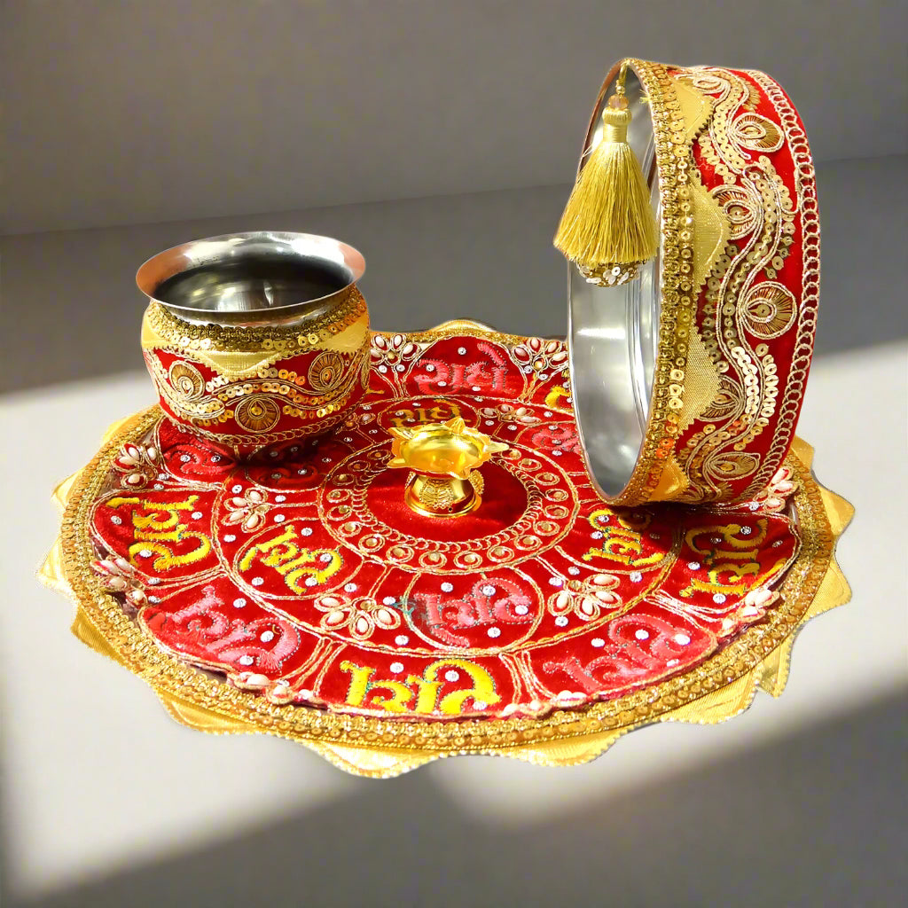 Decorative set with a red and gold plate, cup, and other items on a white background