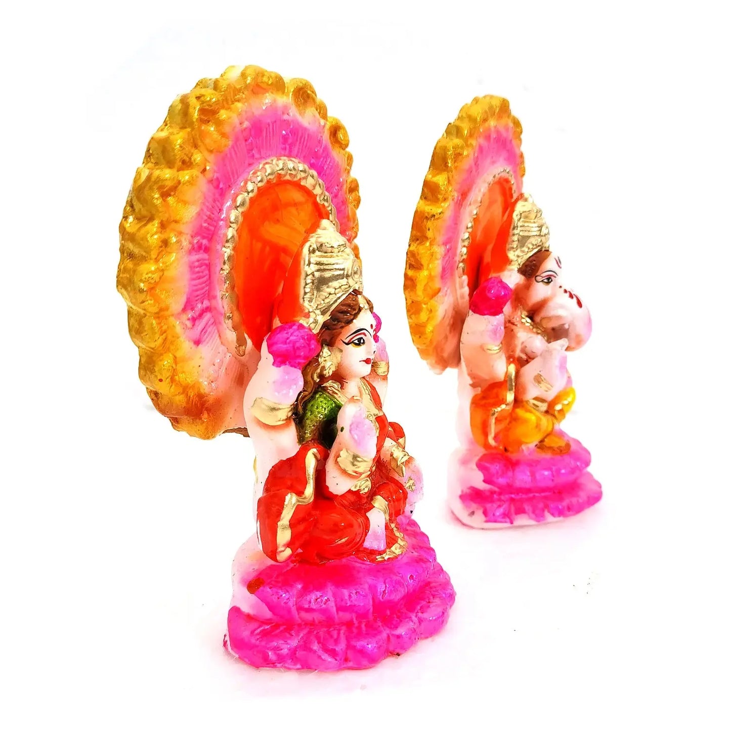 Colorful figurines with a pink and gold design on a white background
