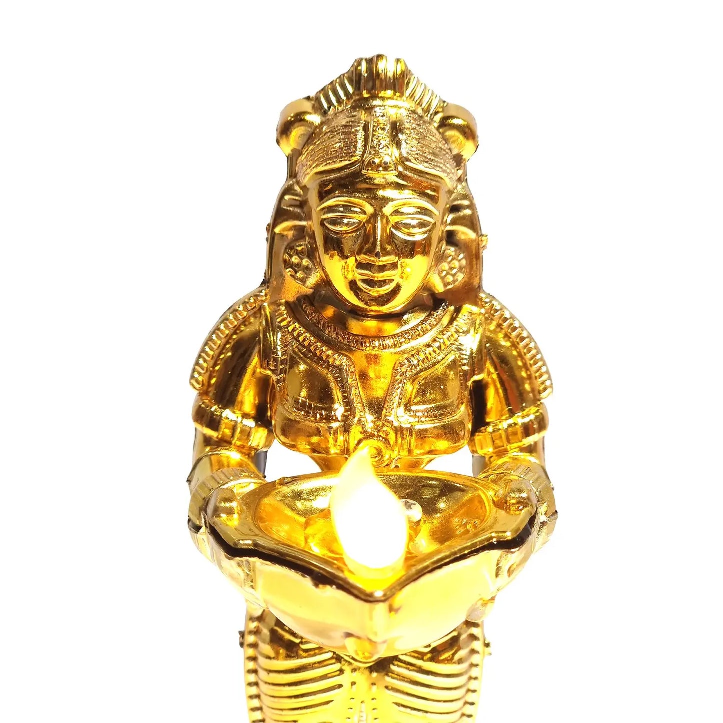 Gold-colored statue holding a lit candle on a white background