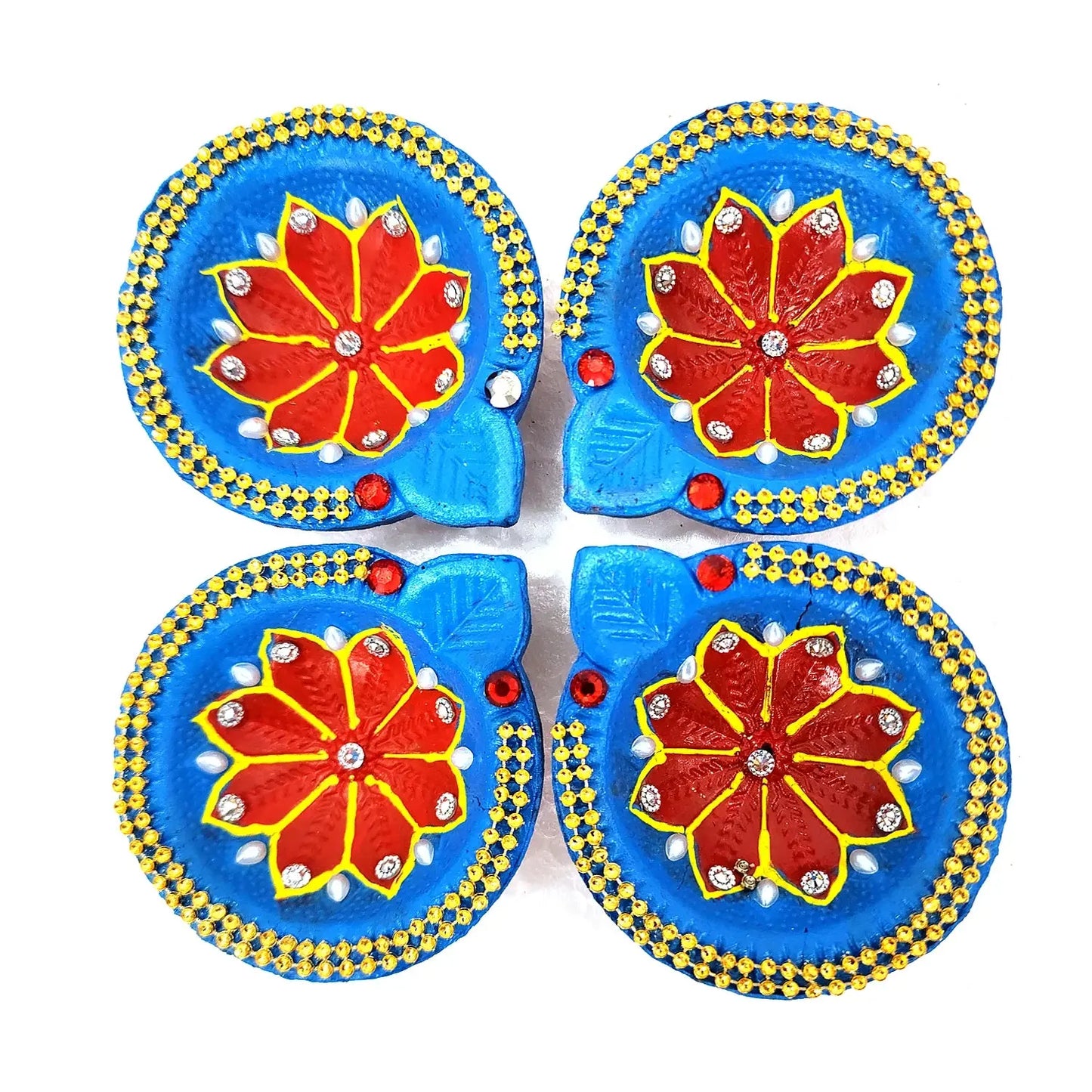 Four decorative items with blue backgrounds and red floral designs on a white background