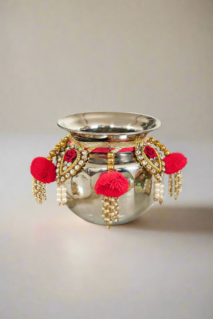 A handcrafted Decorative Lota for Pooja with vibrant colors, elegant mirror work, and traditional lace, used in Hindu rituals.