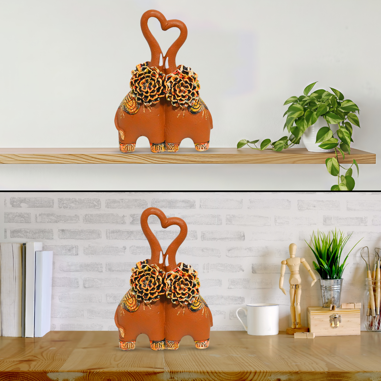 Decorative elephant statues with heart shapes on a shelf against a white brick wall.