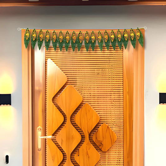Decorative green leaf garland hanging above a wooden door with geometric design.