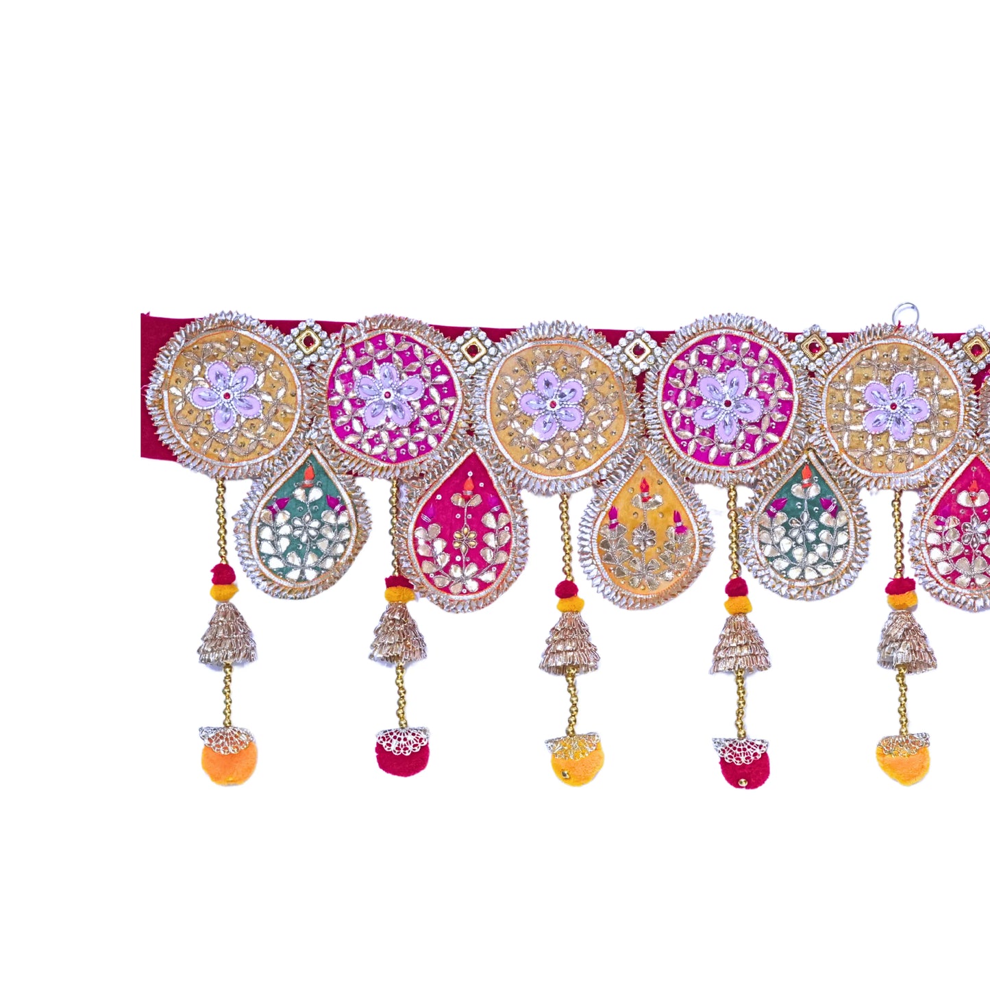Decorative toran with colorful patterns and hanging elements on a white background