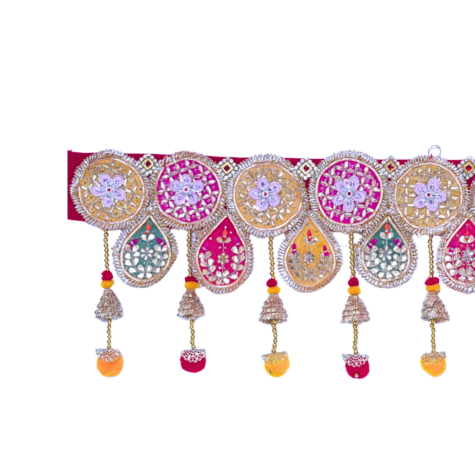 Decorative toran with colorful patterns and hanging elements on a white background
