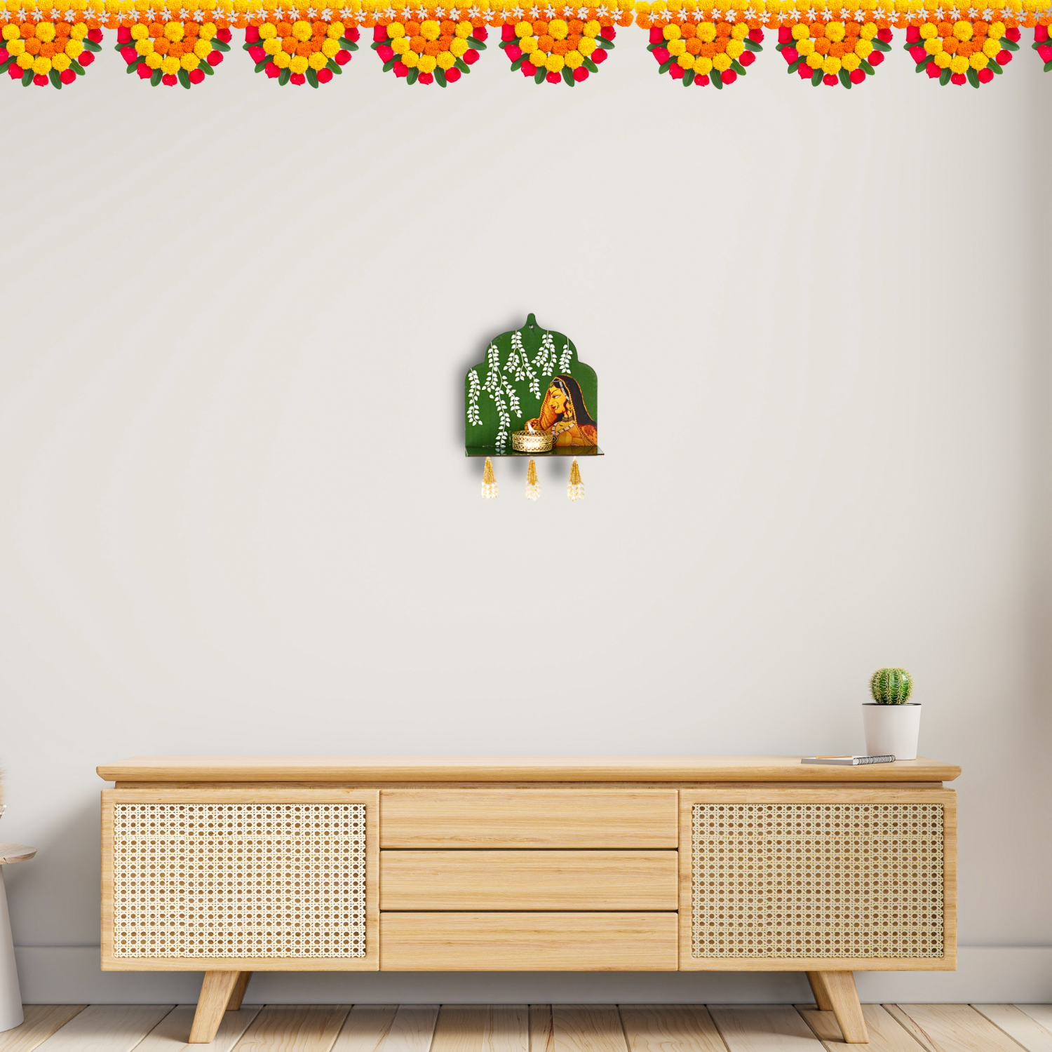 Decorative wall hanging above a wooden cabinet with a white wall and floral border.