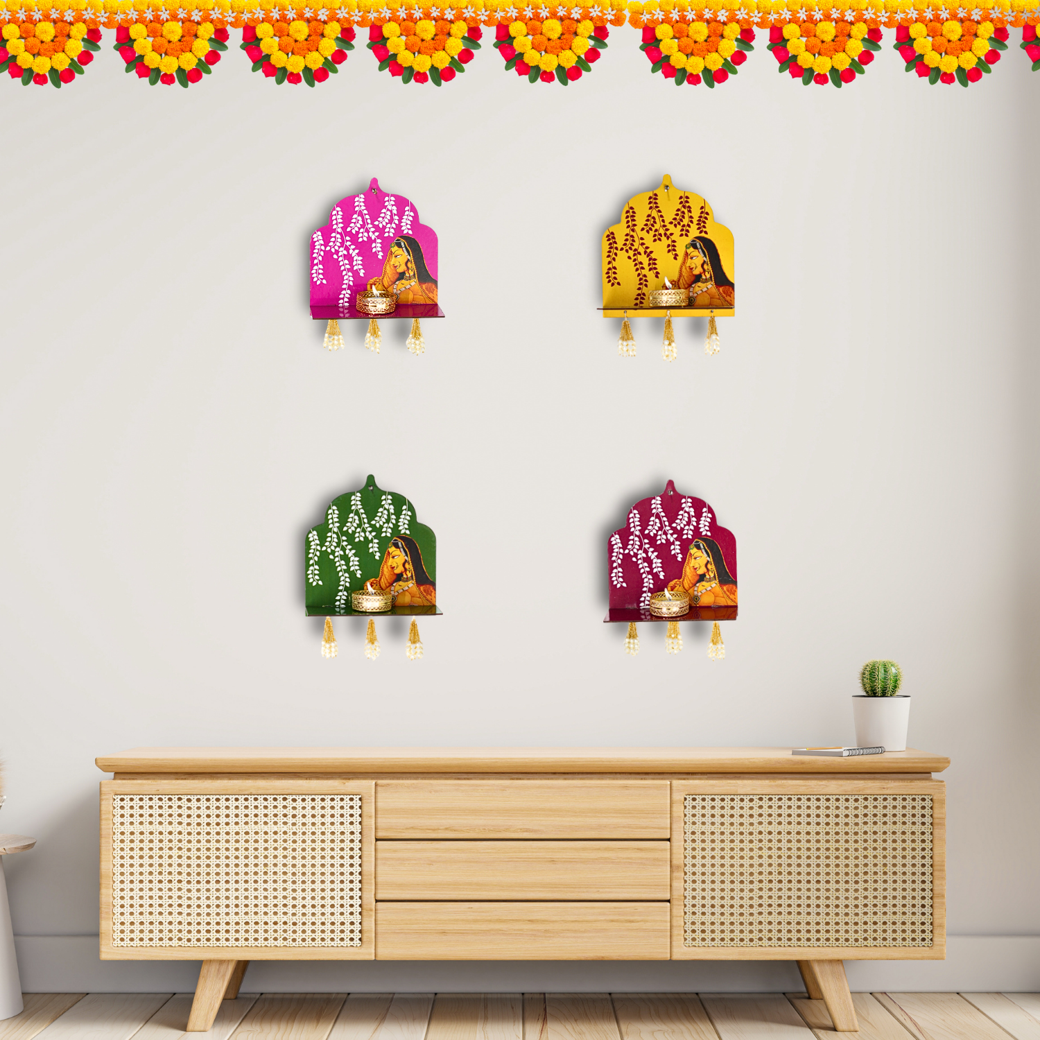 Decorative wall hangings with colorful designs on a white wall above a wooden cabinet.
