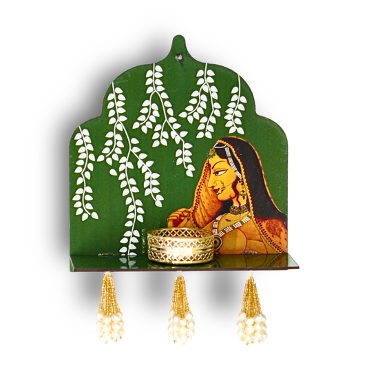 Decorative wall shelf with a green background, white leaves, and a woman's portrait. Three light bulbs are attached to the shelf.