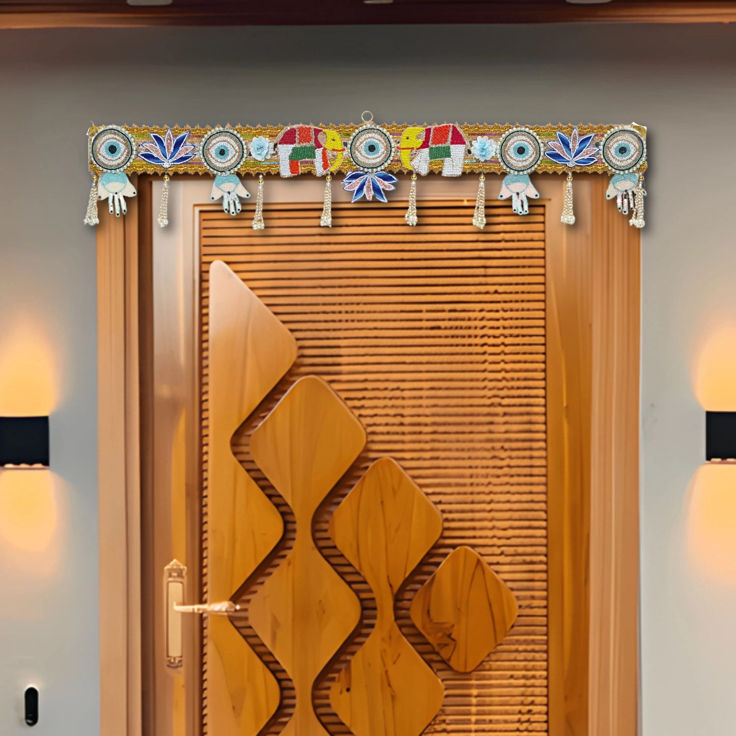 Decorative wooden door with intricate carvings and a colorful door canopy on a gray wall.
