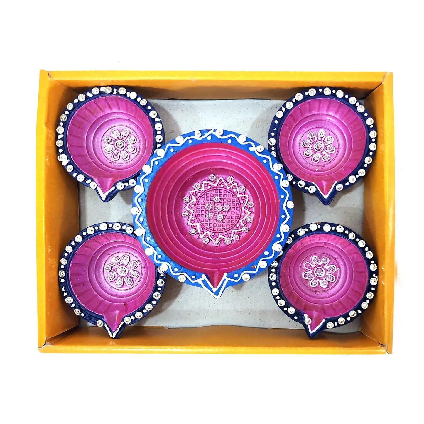 Set of pink and blue decorative items in a yellow box