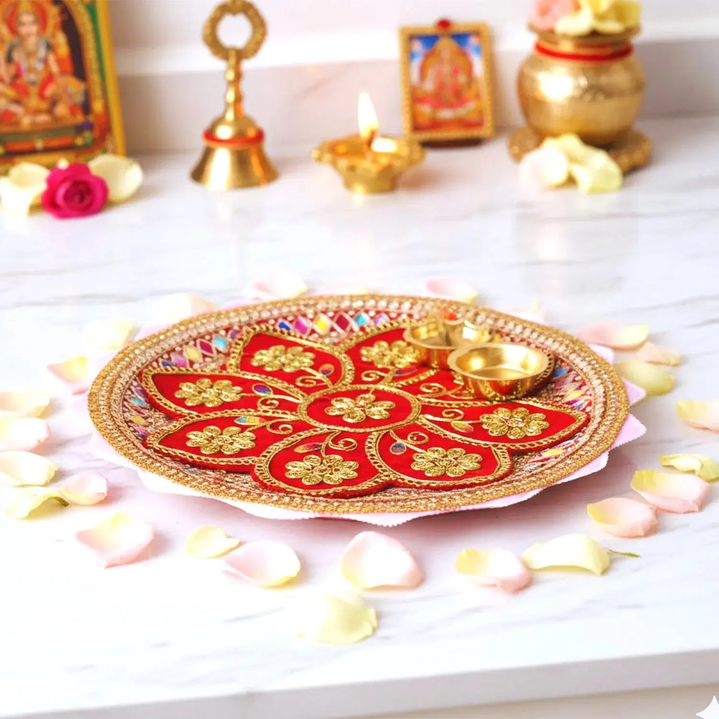 Decorative plate with floral patterns on a white surface with rose petals