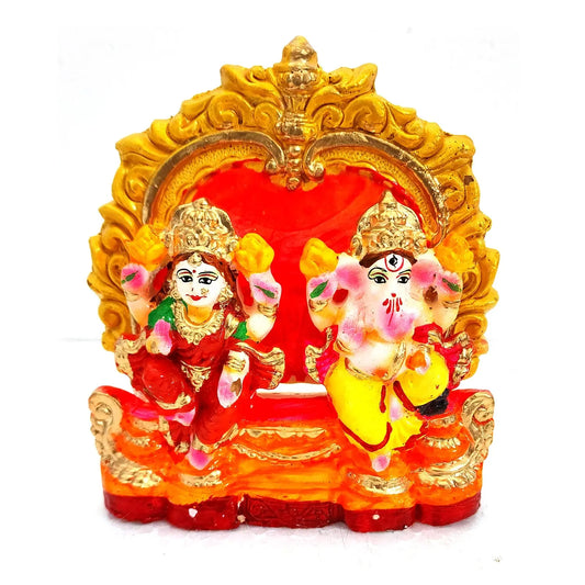 Decorative statue of a deity with a red background on a white background