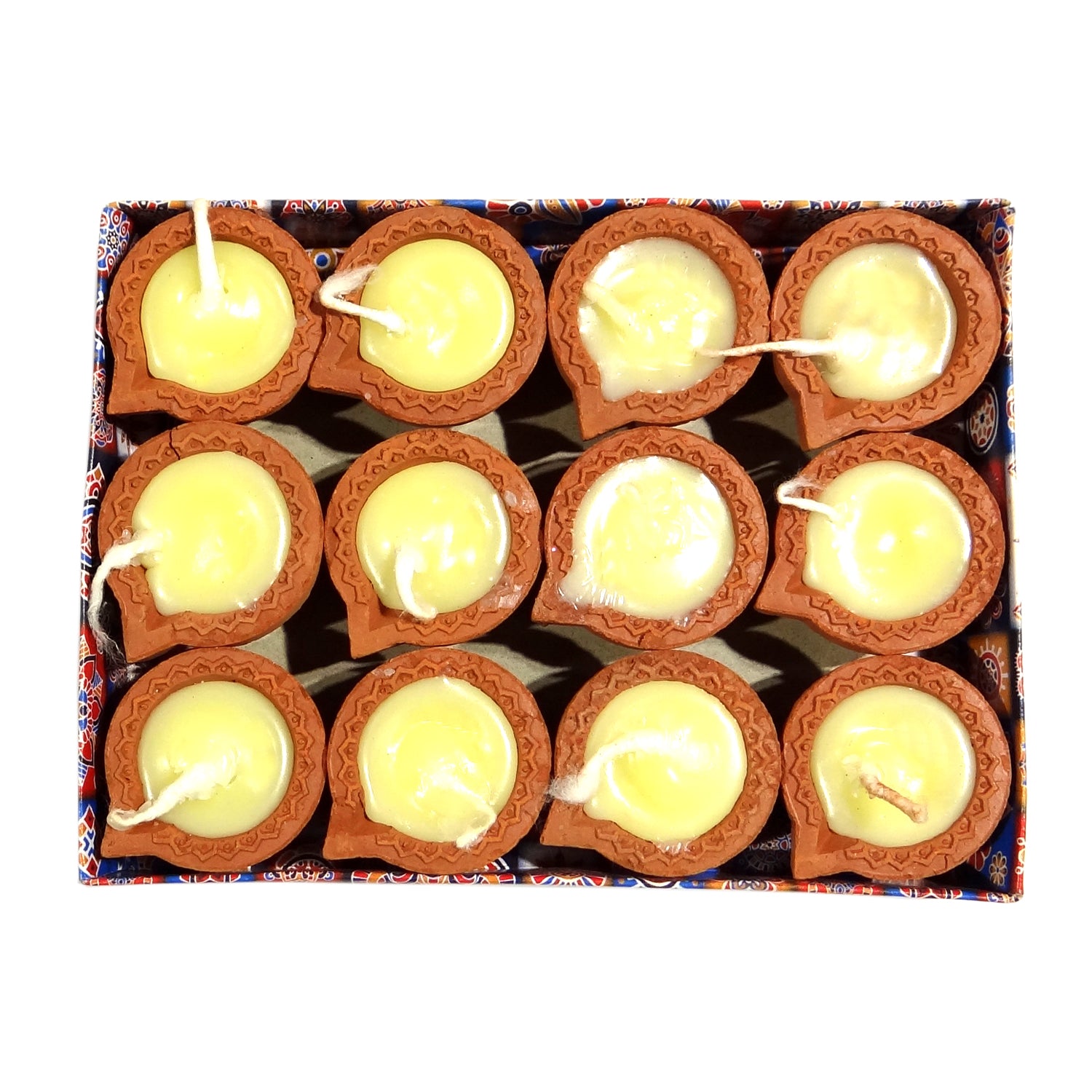 Box of small clay lamps with lit candles inside