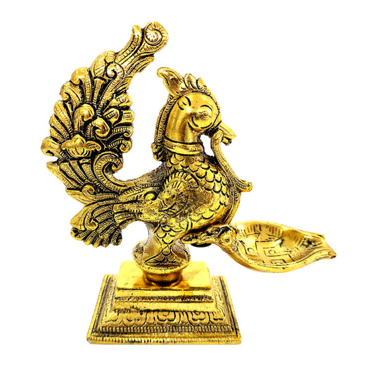 Gold-colored decorative peacock statue on a white background