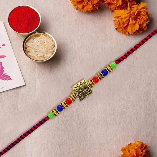 Gold Plated Multi-Colour Dora Rakhi for Brother – Traditional Rakhi with Stylish Thread Design, Elegant Beads & Festival Vibes | Upharkaro Rakhi 2024 Collection-Upharkaro