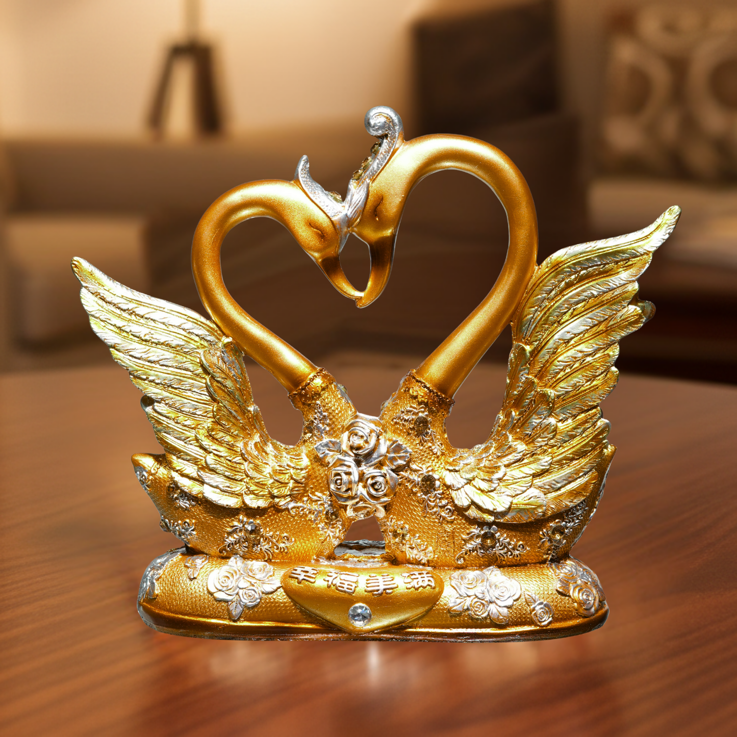 Gold swan sculpture with heart-shaped neck on a wooden surface